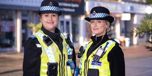 PCSO talking to a member of staff