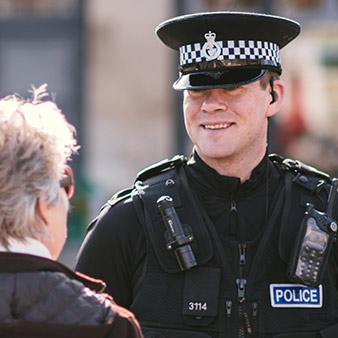 Police Officer talking to a member of the public