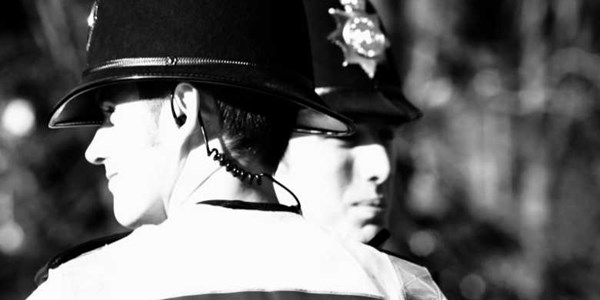 A black and wite image of two police officers
