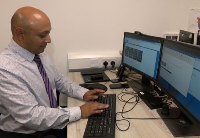 Detective Inspector Praveen Naidoo sat at his desk