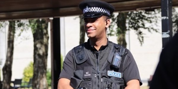 A Special Officer smiling in the sun shine