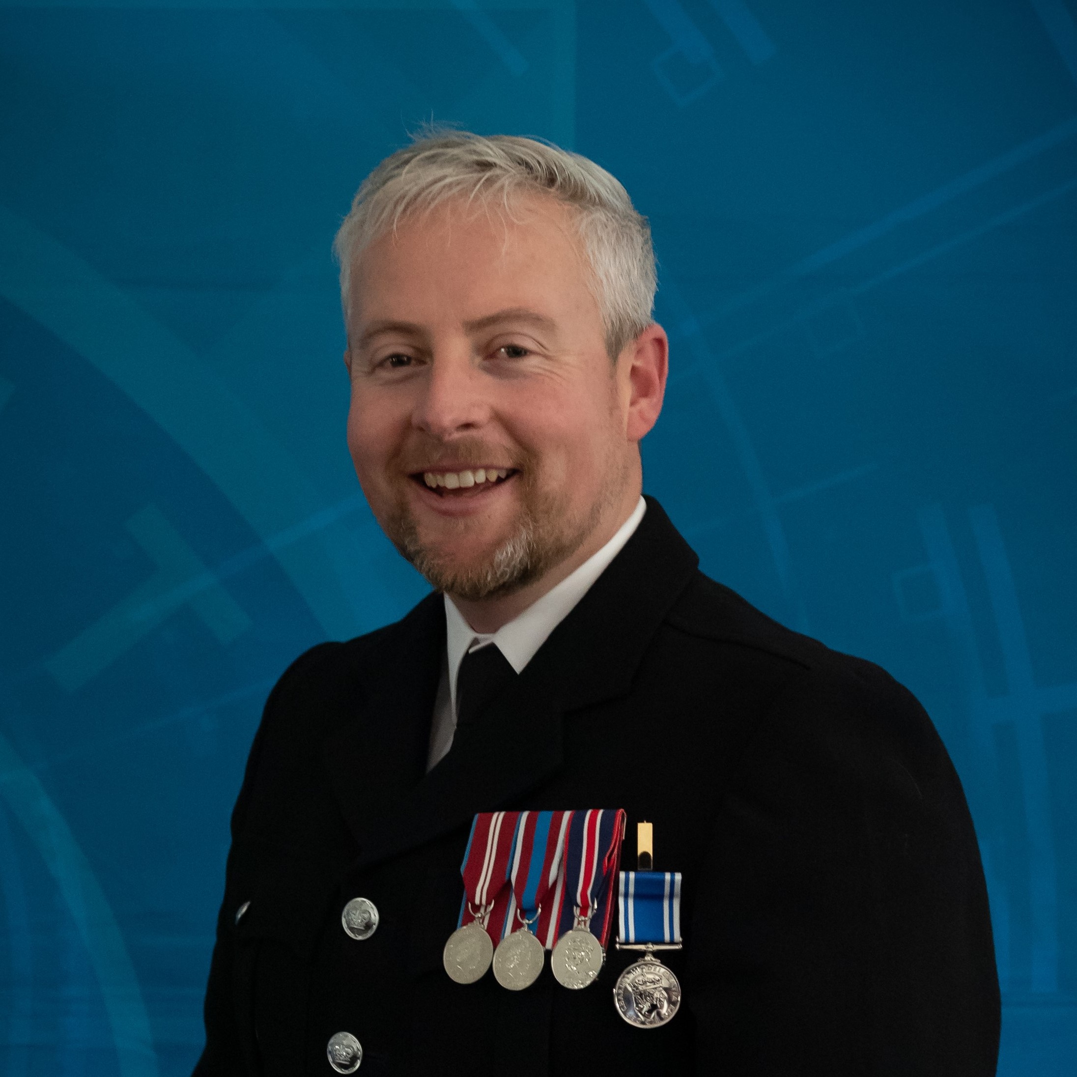 PC Cooke in formal uniform and medals smiling