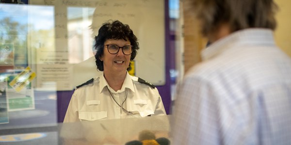 Female counter services office at police station
