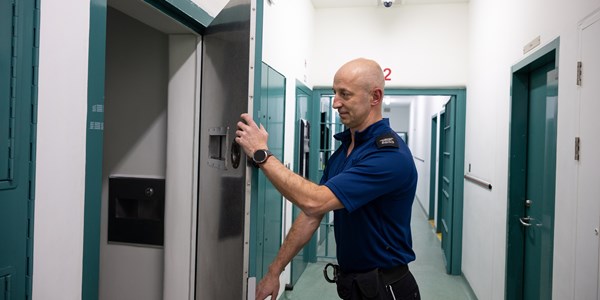 Detention Officer opening a door