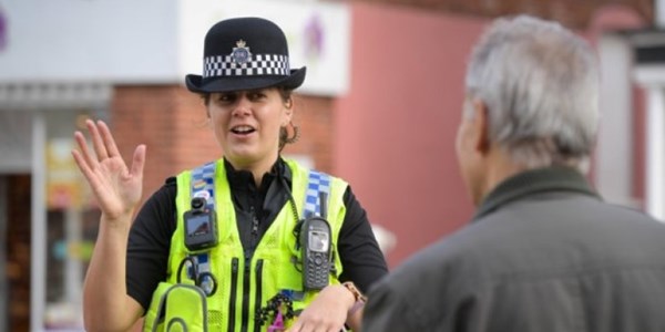 Police Officer talking to MOP