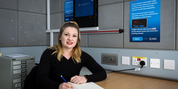 Women Police Staff Investigator smiling