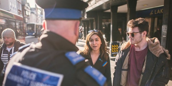 PCSO talking to a member of staff